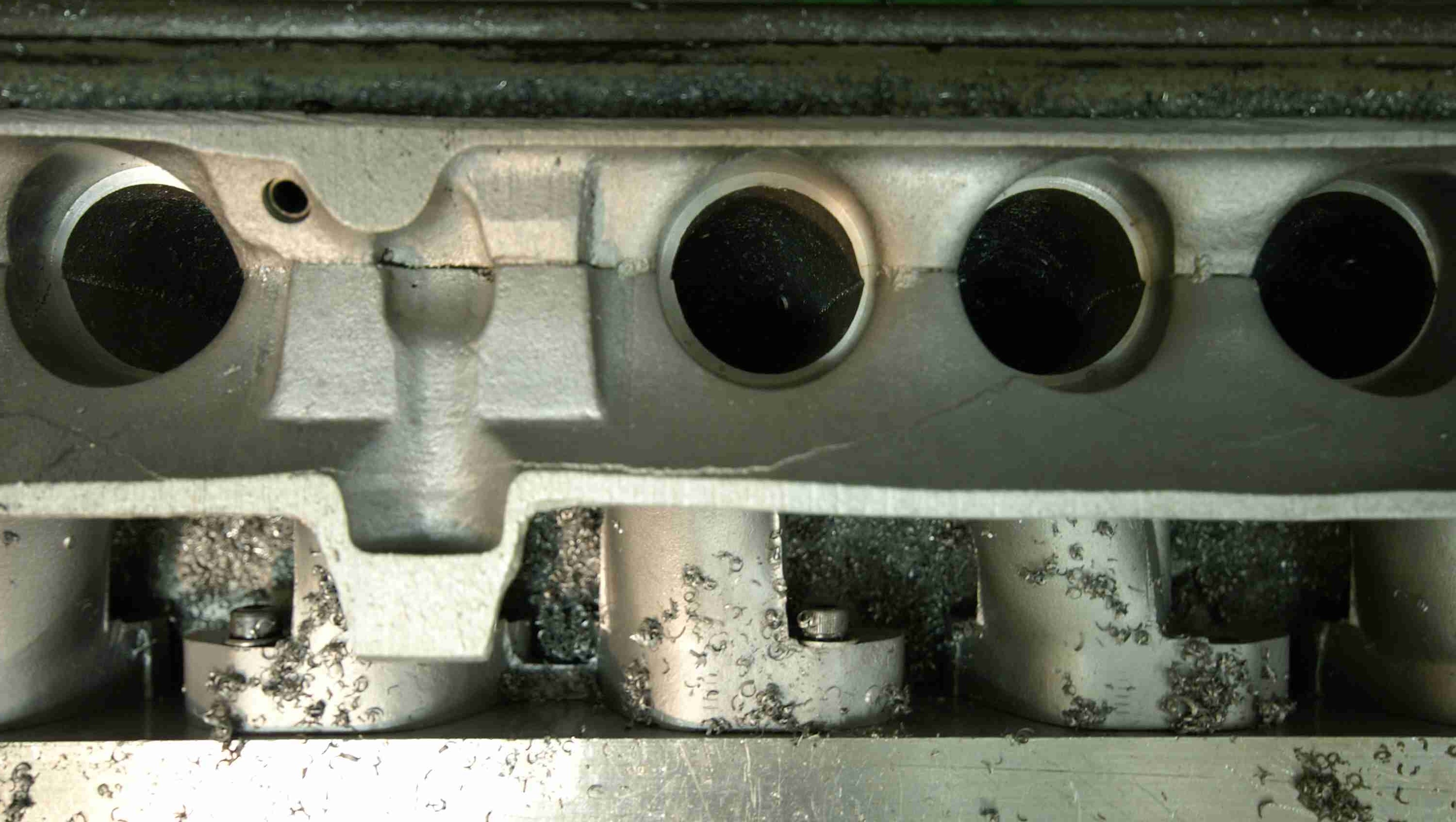 Cut-open V12 inlet manifold bored to accept bellmouth extensions to boost torque.